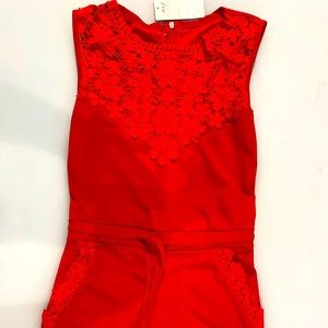 Jumpsuit with lace top and pants pockets.